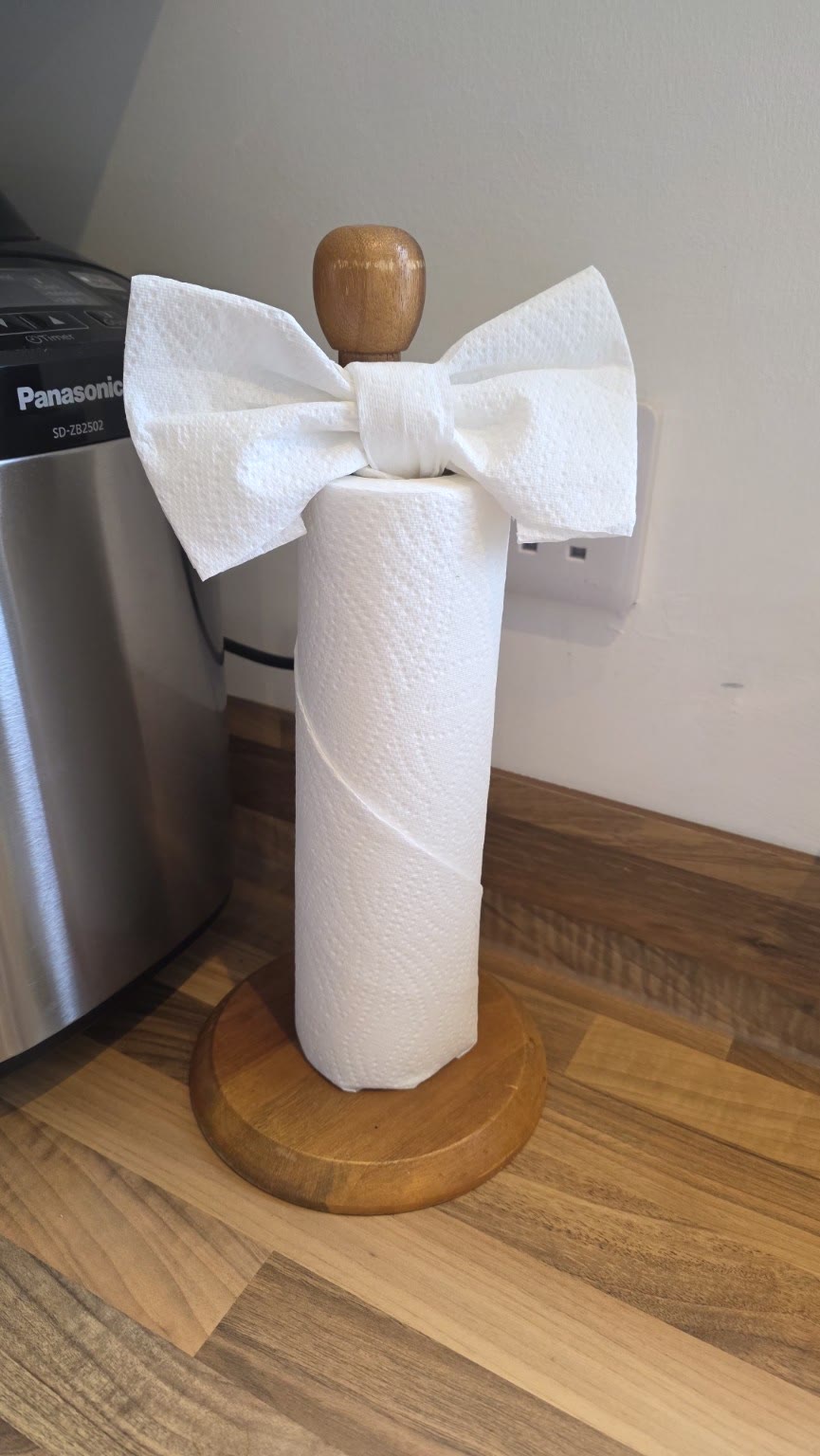 Kitchen roll folded into a neat decorative bow