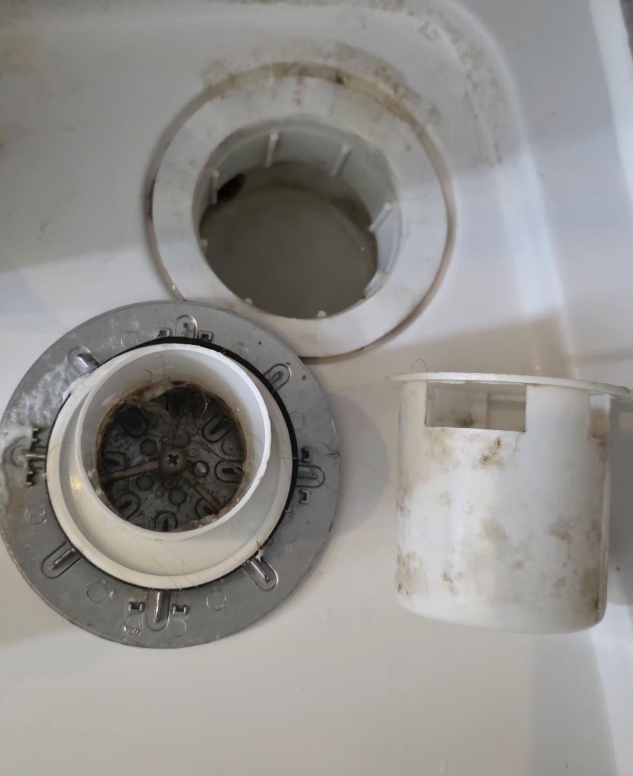 Removable bathroom fitting with hidden grime before detailed cleaning