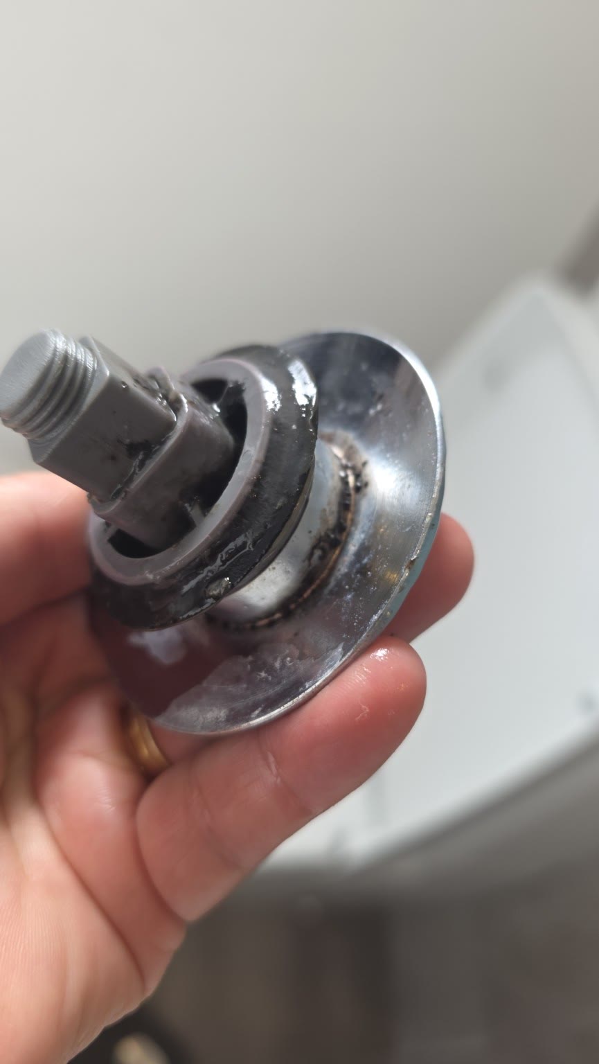 Plug mechanism with grime around the hidden edges before cleaning